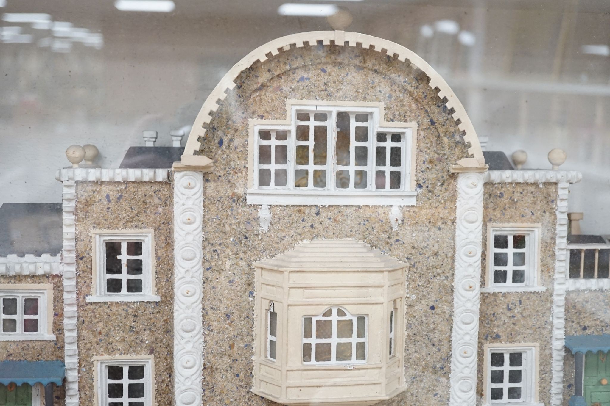 A diorama of a country house, case 63 cm wide